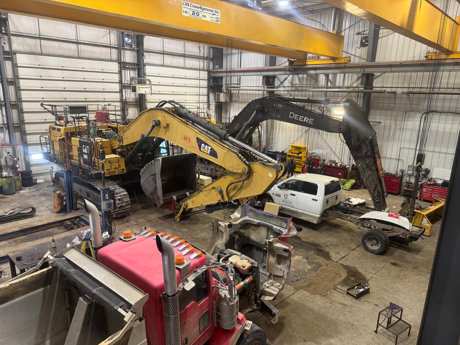 CIMW shop — heavy equipment being restored under 20-ton overhead cranes