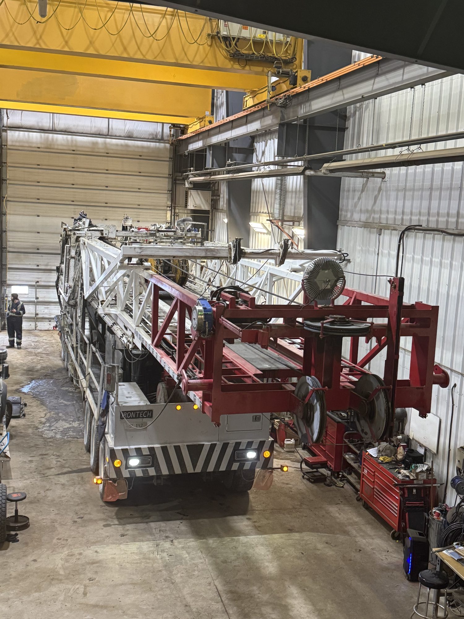 CIMW shop — Irontech drilling rig under the 20-ton overhead crane in the bay
